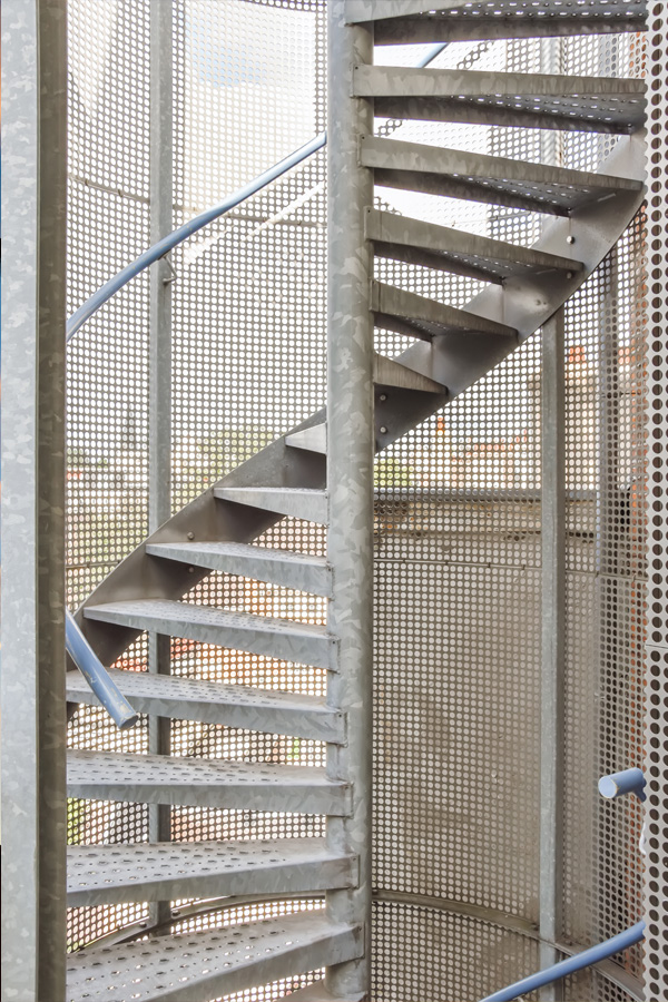Ironworker installing structural steel beams during commercial construction.