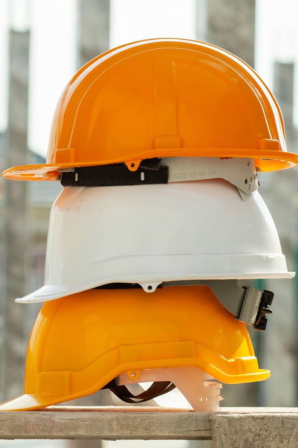 Ironworker installing structural steel beams during commercial construction.